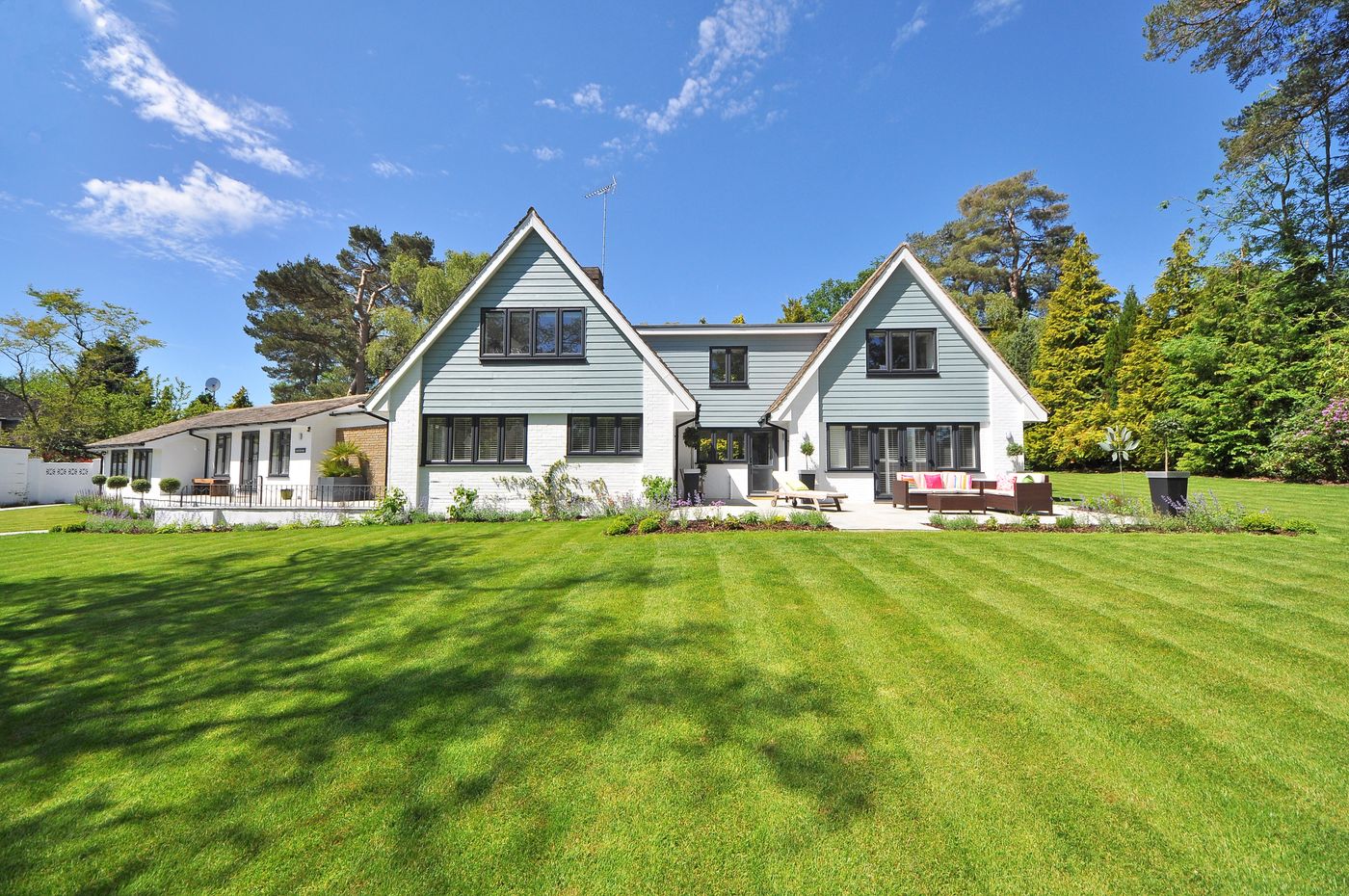 A Tampa home with a neatly striped, professionally mowed front lawn